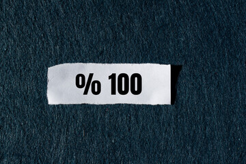 One hundred percent message written on ripped torn paper background. Conceptual One hundred percent symbol. Copy space.