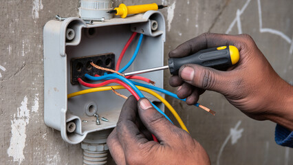 electrician fixing electrical wires
