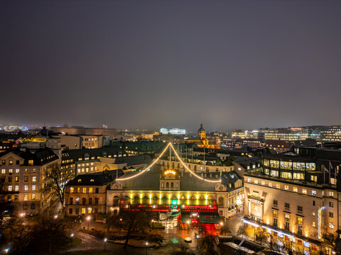 Aerial view of the brightly lit facade of the Oscar Theatre glows against the dark Stockholm night sky, Stockholm, Stockholm County, Sweden.
