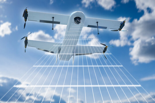 Aerial surveying as a VTOL drone captures high-resolution data while flying over terrain, using advanced sensors for mapping, monitoring and remote inspection tasks.