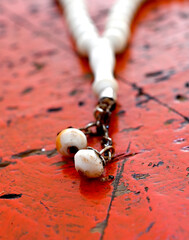 close up of rosary beads, religion theme and concept