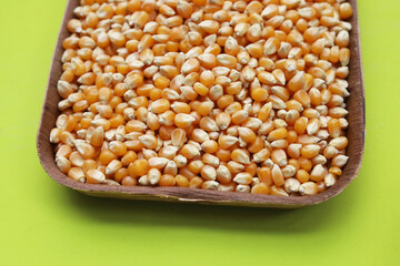 Dry yellow corn seeds ready to be made into popcorn.