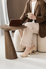 Person Enjoying Coffee and Writing In Notebook