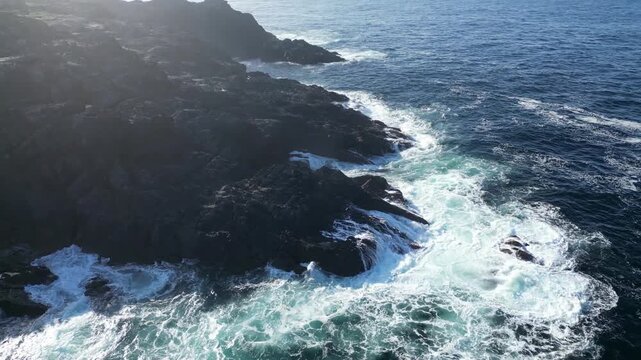 Aerial view of waves hitting rocky Coast of Galicia 4k drone