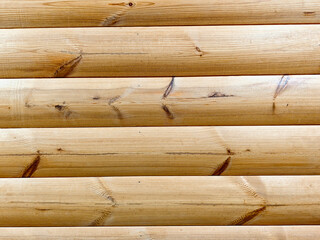 Fototapeta premium Wooden planks arranged horizontally displaying natural grain patterns in a simple background suitable for text overlay and design projects at any time of day