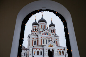 Alexander Nevsky Cathedral framed by archway in Tallinn Old Town, Estonia