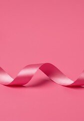 Luxurious satin pink ribbon gracefully curled and styled on a vibrant monochromatic pink surface creating a beautiful and elegant display ,support, magenta, studio
