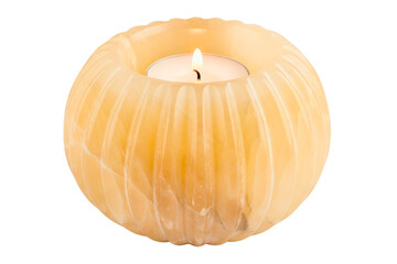 Round yellow onyx stone candle holder with burning tea light on isolated background