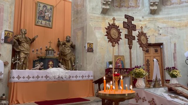 candles and crosses inside church
