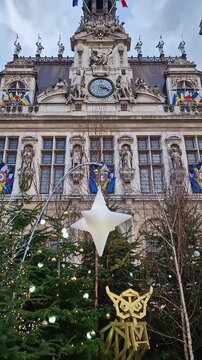 Paris, France - December 10, 2025: Hotel de Ville in Paris during the winter holidays decorated with Christmas trees and festive lights