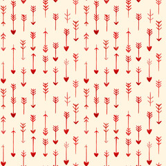 Stylish pattern featuring various red arrows and hearts on light beige background, creating playful and romantic design perfect for textiles or wallpapers