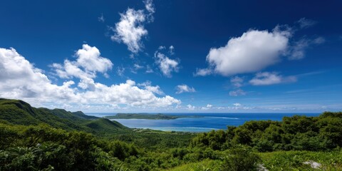 Scenic view of lush island landscape with blue ocean and sky