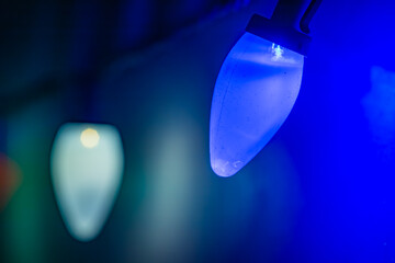 Blue and green Christmas lights on a garland, macro
