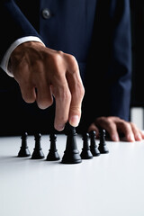 businessman plans chess strategy to win business competition and success
