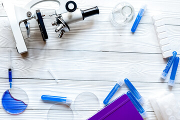 doctor workplace at wooden table in lab top view