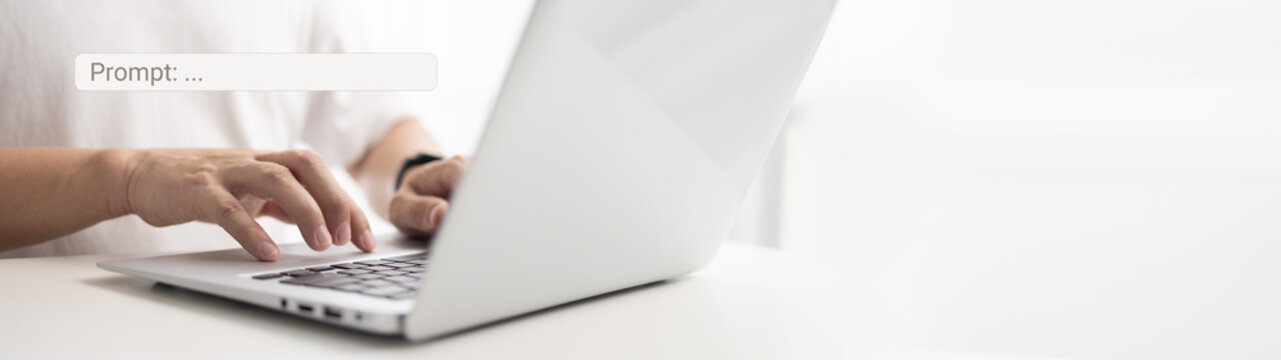 Prompt engineering skills concept. Businessman working on laptop 
with exploring artificial intelligence ai technology innovation and typing a prompt into search bar on keyboard computer