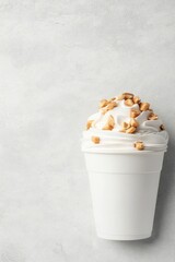 Small White Cup Holds Creamy Dessert Topped With Crunchy Crumble Against Neutral Background; Gluten-free Low-carb Option
