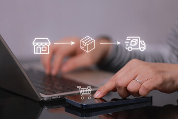 Focused women managing an owned ecommerce business. Online shopping icon for order and delivery process on screen