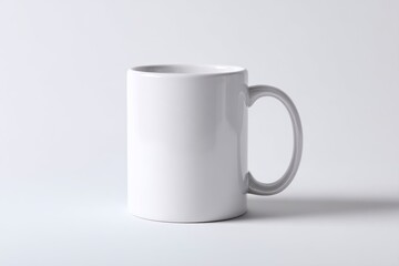Fototapeta premium Blank white ceramic mug on a light gray background.