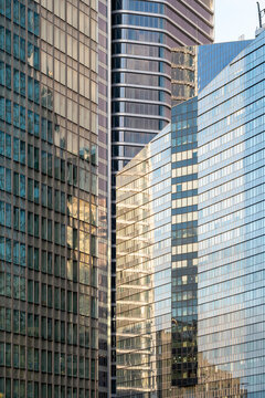 Abstract modern architecture office building facade expressing corporate business finance in urban context, professional financial background with geometric structure