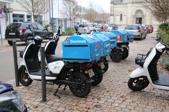 Domino's Pizza restaurant with delivery scooters