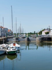 Marans in Charente-Maritime, river and sea town between marsh and sea. Lock between Quai Mar&eacute;chal Foch and Quai des Fusilliers Marins on the S&egrave;vre Niortaise canal
