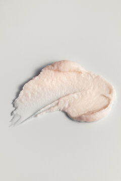 Macro swatch of shaving body cream on minimal cleam background