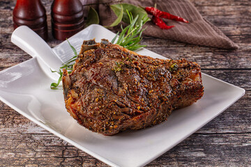 Baked beef steak on the bone