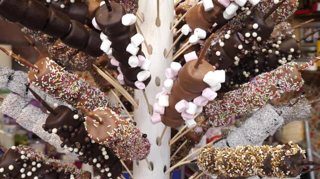 A variety of sweets on sticks at a stall at a Christmas market in France