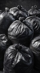macro close-up of tied black garbage bags forming a dense bin wall &mdash; glossy crumpled plastic sacks with knotted tops, studio lighting, moody texture