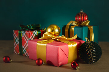 Elegant red and green gift boxes with Christmas balls.