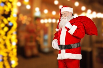Santa Claus standing hold bag with gifts