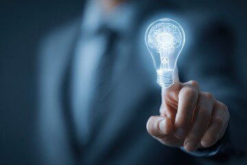 Businessman touches glowing lightbulb icon representing an idea.