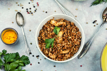 Bowl of buckwheat porridge on table.