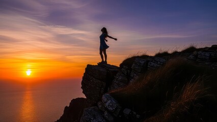 Silhouette of Woman at Sunset on Cliff Ocean Freedom Nature. Concept featuring sunset, cliff, silhouette, woman, ocean.