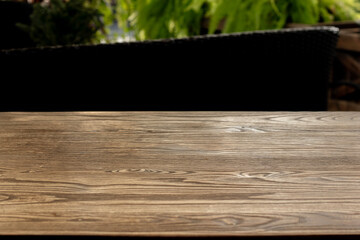 Wooden table surface with natural cafe background