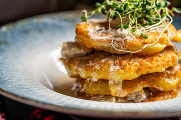 Golden Potato Pancakes With Creamy Mushroom Sauce