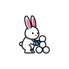 White rabbit building a small snowman.