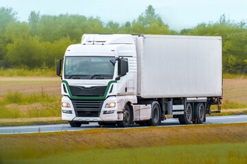 Freight truck transporting goods in countryside