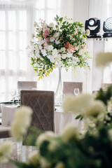 Elegant floral arrangement at a dining table setting