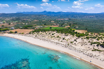 Aerial view of the beach at Romanos, Messinia, Greece, with emerald sea and sand dunes
