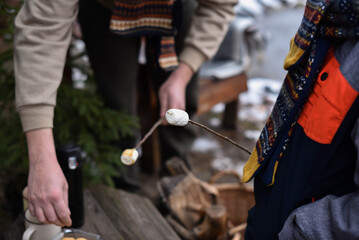 Roasted marshmallows with cookies. Family weekend fun