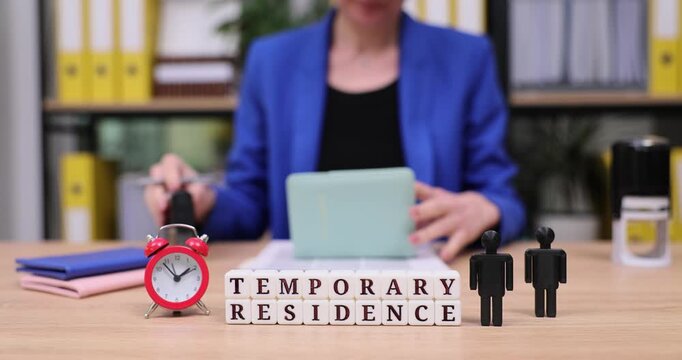 Busy moments of preparing documents for temporary residence application at a bustling office