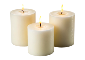 Three lit white pillar candles on a reflective surface creating a warm and serene ambiance perfect for holiday celebrations or spa relaxation scenes.