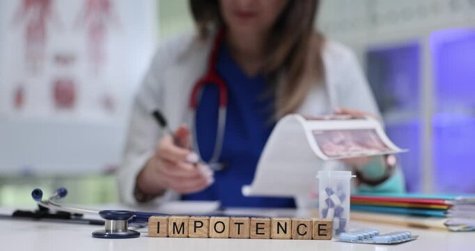 Word Impotence on wooden cubes near pills and doctor checking ultrasound scans. Physician diagnosis erectile dysfunction of patient in hospital