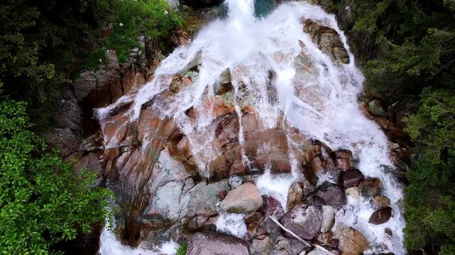 Close up aerial drone view of V&ograve; Waterfall in Val di Scalve, Orobie Alps. Powerful water cascading over rocks in Italian nature landscape
