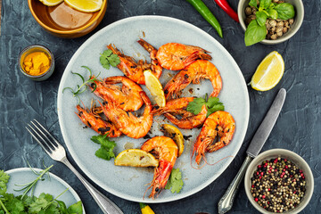 Roasted langoustines prawns in plate on table.