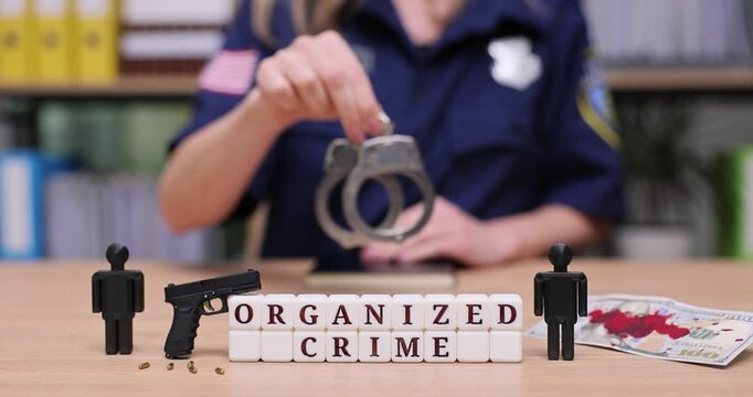 Exploring the shadows of organized crime with handcuffs and evidence display