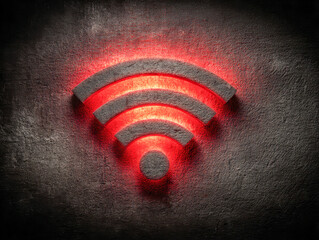 Glowing red signal icon carved into textured dark wall representing network connectivity and digital communication technology concept