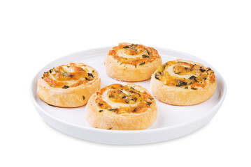 Basil garlic cheese roll cake pinwheel in a plate on a white isolated background
